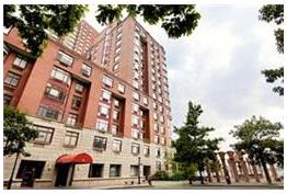 350 Albany Street, Unit 12C Manhattan, NY 10280 - Photo 5 of 6 a view of building with lot of trees