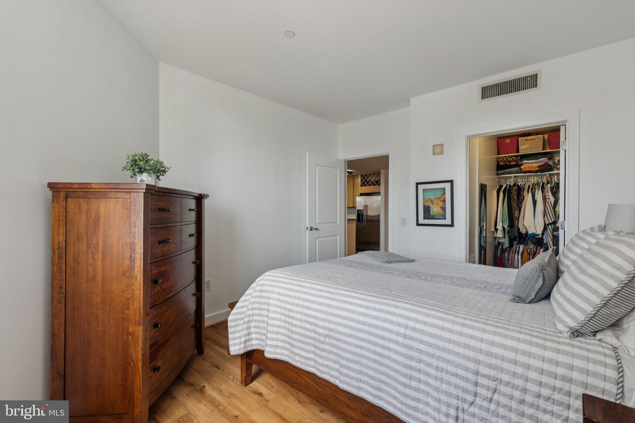 111 South 15th Street, Unit 2106 Philadelphia, PA 19102 - Photo 19 of 31 a bedroom with a bed and a closet