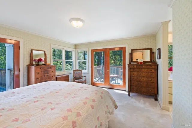 a view of a patio with table and chairs potted plants