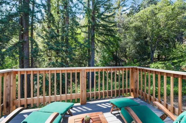 a view of a patio with table and chairs and potted plants