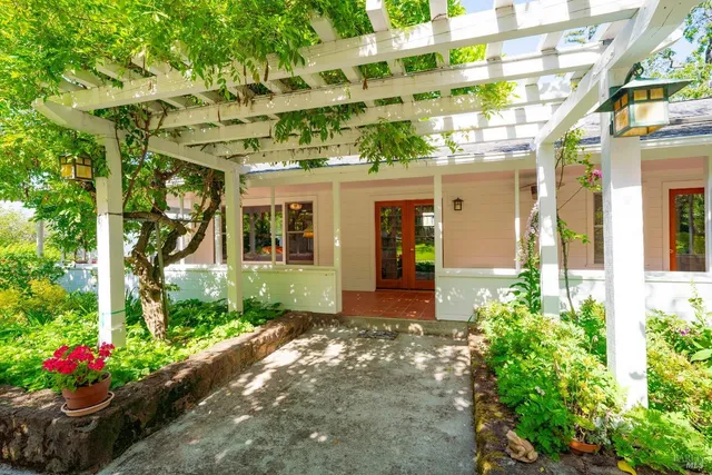 a view of a pathway both side of house