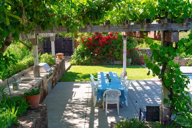 a work room with furniture and a large window