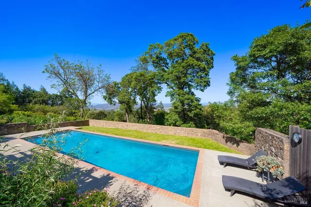 a kitchen with a sink and a large window
