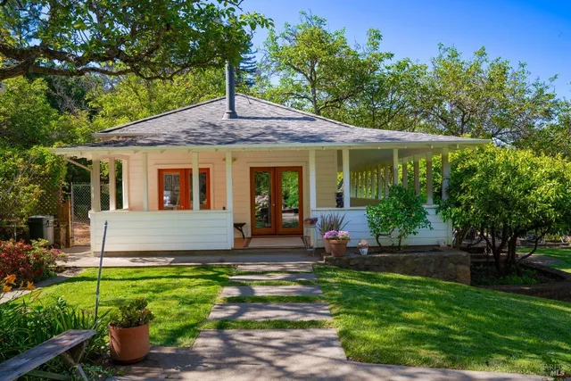 a view of yard with green space and seating area