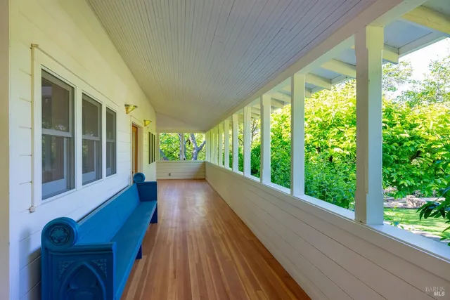 a front view of a house with a flower garden