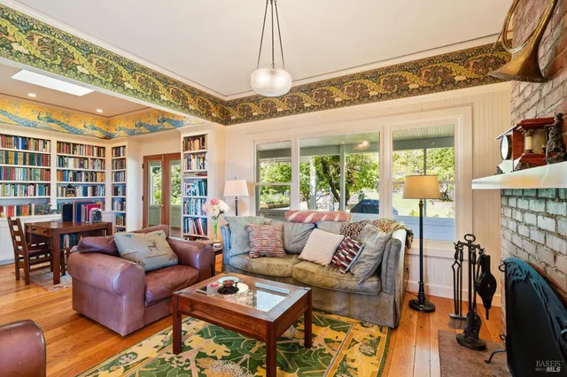 a kitchen with stainless steel appliances granite countertop sink stove and large window
