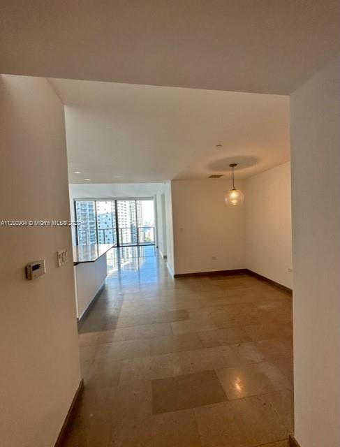 68 Southeast 6th Street, Unit 2507 Miami, FL 33131 - Photo 11 of 46 a view of an empty room with a window
