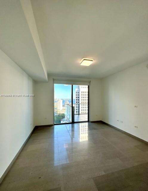 68 Southeast 6th Street, Unit 2507 Miami, FL 33131 - Photo 14 of 46 an empty room with windows