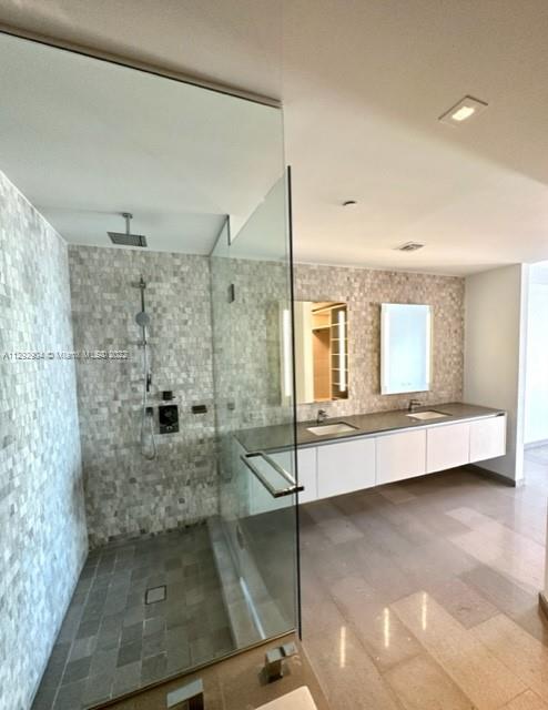 68 Southeast 6th Street, Unit 2507 Miami, FL 33131 - Photo 18 of 46 a bathroom with a shower