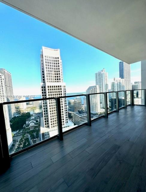 68 Southeast 6th Street, Unit 2507 Miami, FL 33131 - Photo 2 of 46 a view of a floor to ceiling window and wooden floor