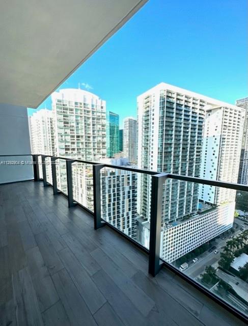 68 Southeast 6th Street, Unit 2507 Miami, FL 33131 - Photo 3 of 46 a view of balcony with wooden floor