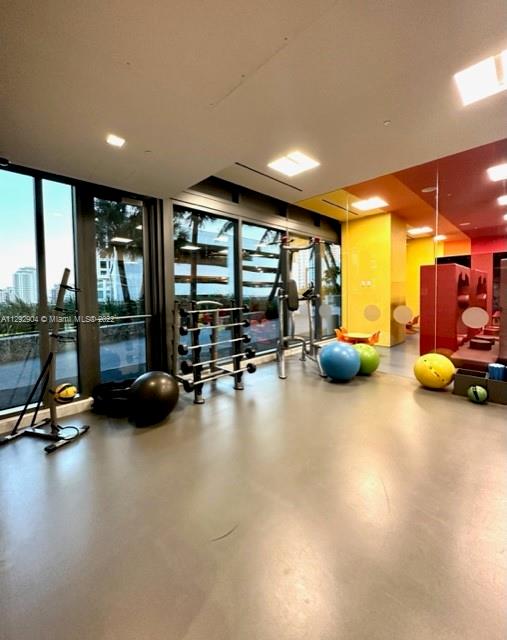 68 Southeast 6th Street, Unit 2507 Miami, FL 33131 - Photo 34 of 46 a view of a room with gym equipment