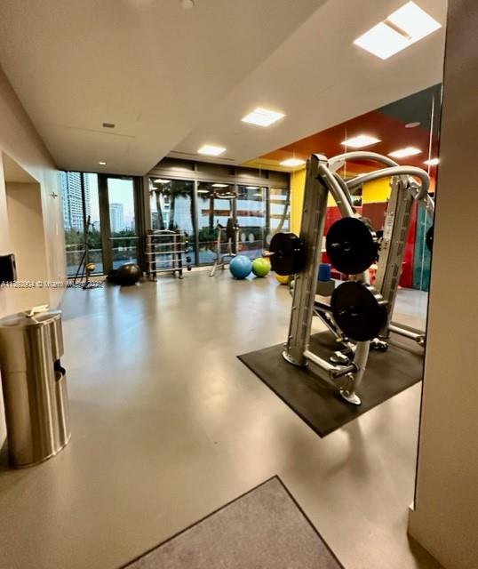 68 Southeast 6th Street, Unit 2507 Miami, FL 33131 - Photo 36 of 46 a view of a room with gym equipment