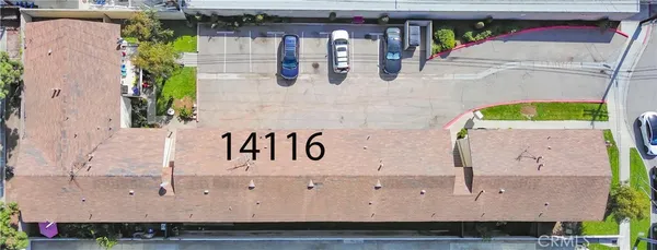 a view of brick house with large windows