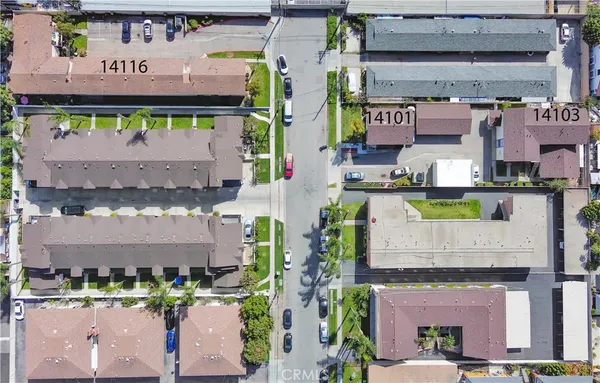 a view of a green field with wooden fence