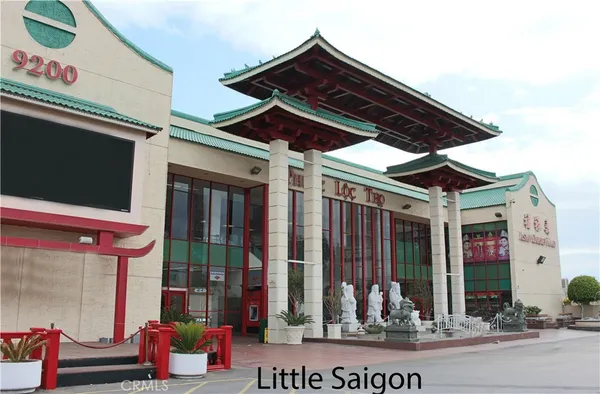 a front view of a building with a yard