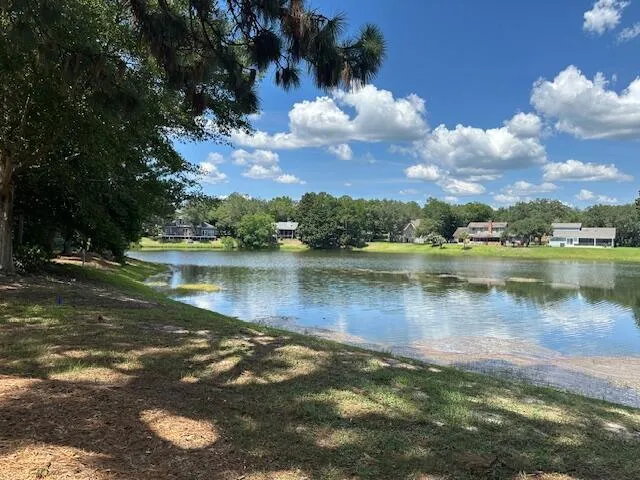 a view of a lake with a building in the background