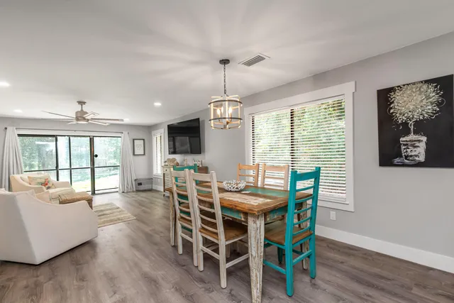 a view of a dining room with furniture window and wooden floor