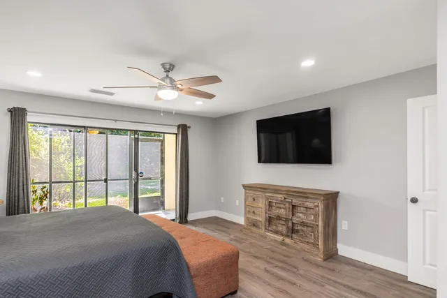 a bathroom with a double vanity sink mirror and shower