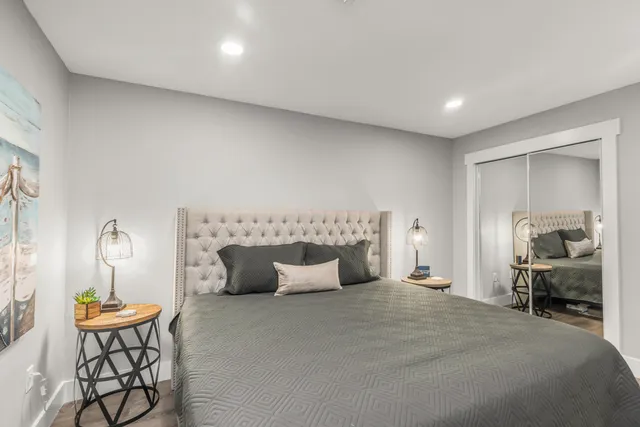 a bedroom with bed and a window