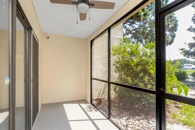 a view of a swimming pool with a yard