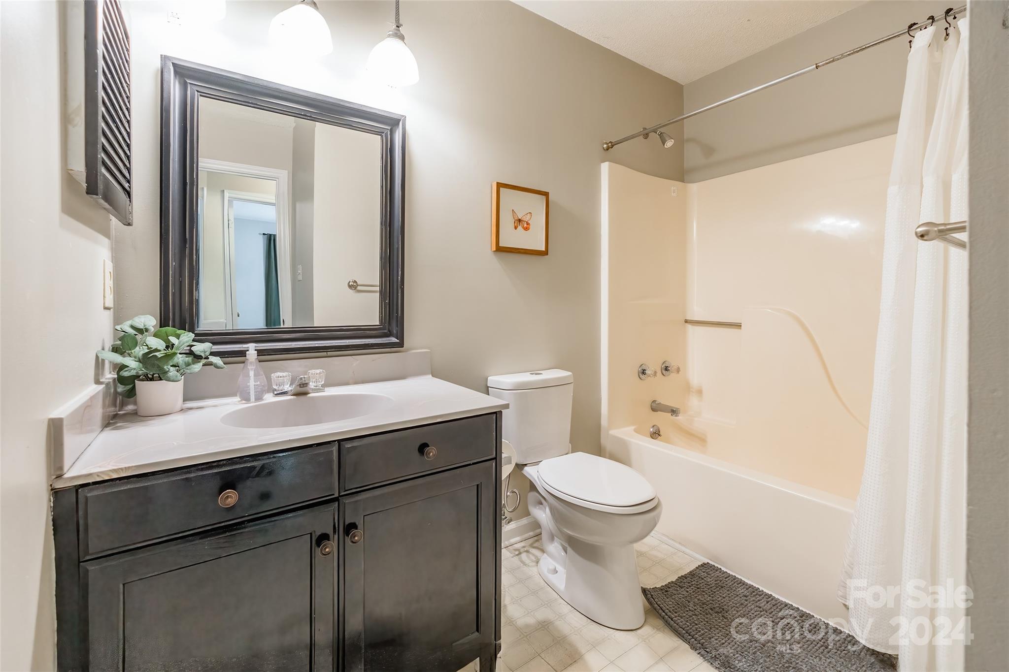 218 Bubbling Well Road Denver, NC 28037 - Photo 20 of 25 a bathroom with a sink and a mirror