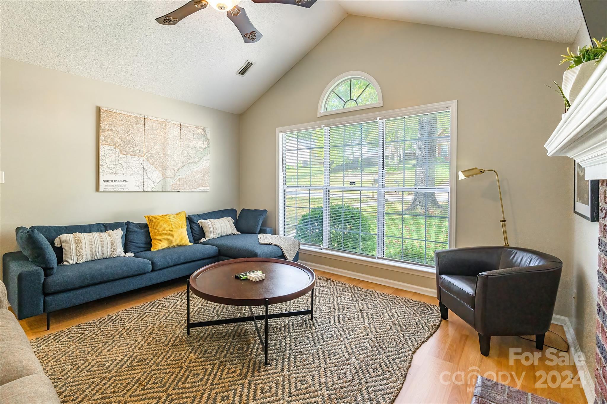 218 Bubbling Well Road Denver, NC 28037 - Photo 6 of 25 a living room with furniture and a large window