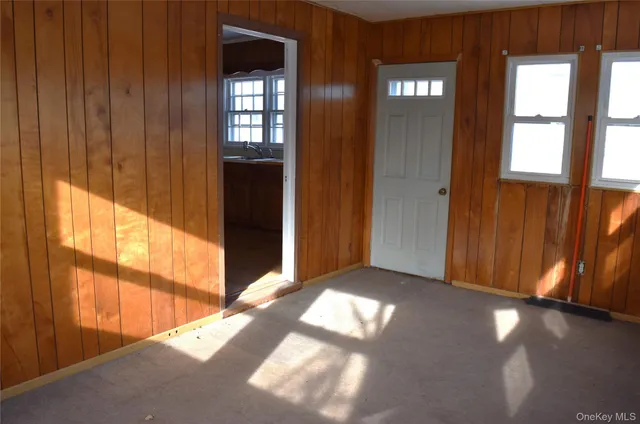 a view of an empty room and window