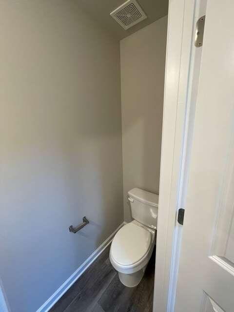 115 Deer Crossing Temple, GA 30179 - Photo 16 of 27 a white toilet sitting next to a shower
