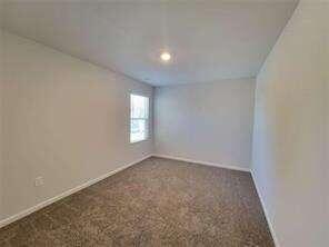 115 Deer Crossing Temple, GA 30179 - Photo 22 of 27 an empty room with windows