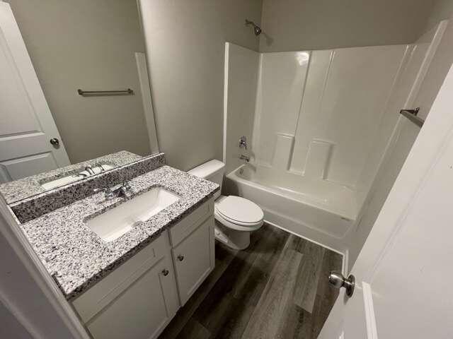 115 Deer Crossing Temple, GA 30179 - Photo 23 of 27 a bathroom with a granite countertop sink toilet and shower