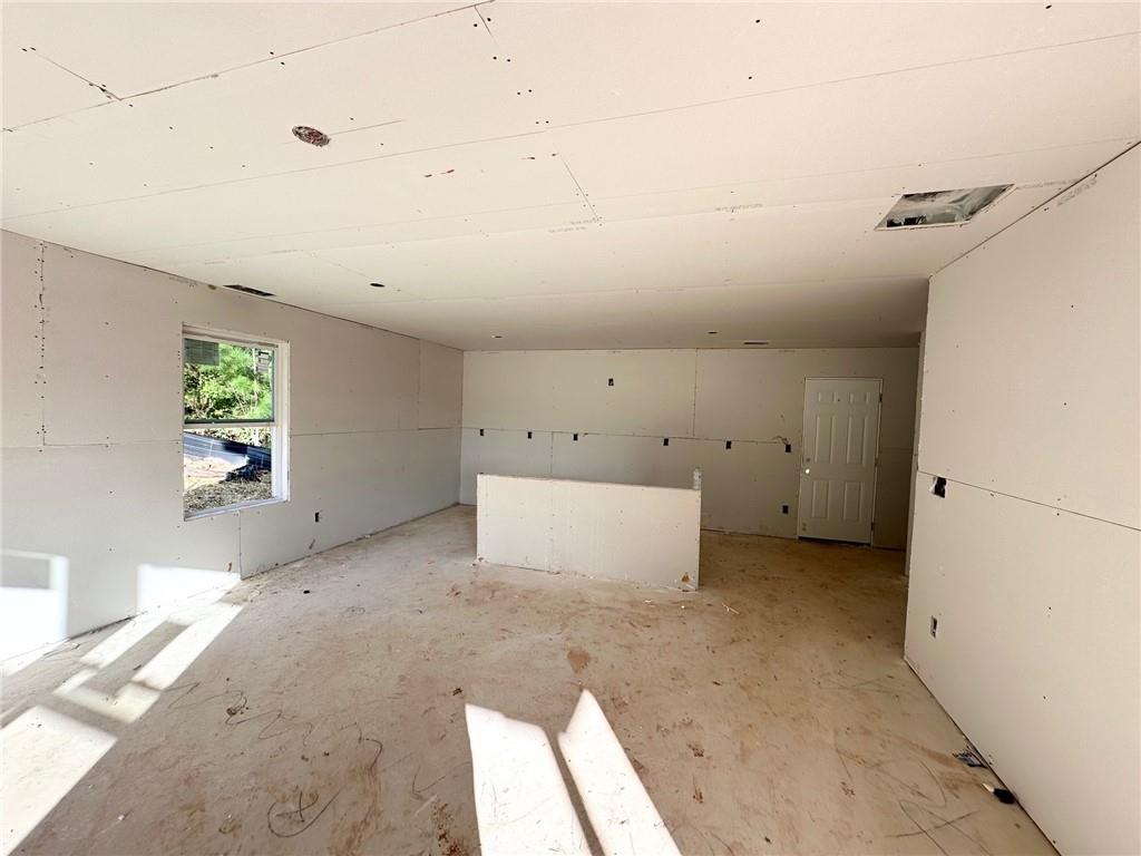 115 Deer Crossing Temple, GA 30179 - Photo 6 of 27 an empty room with windows