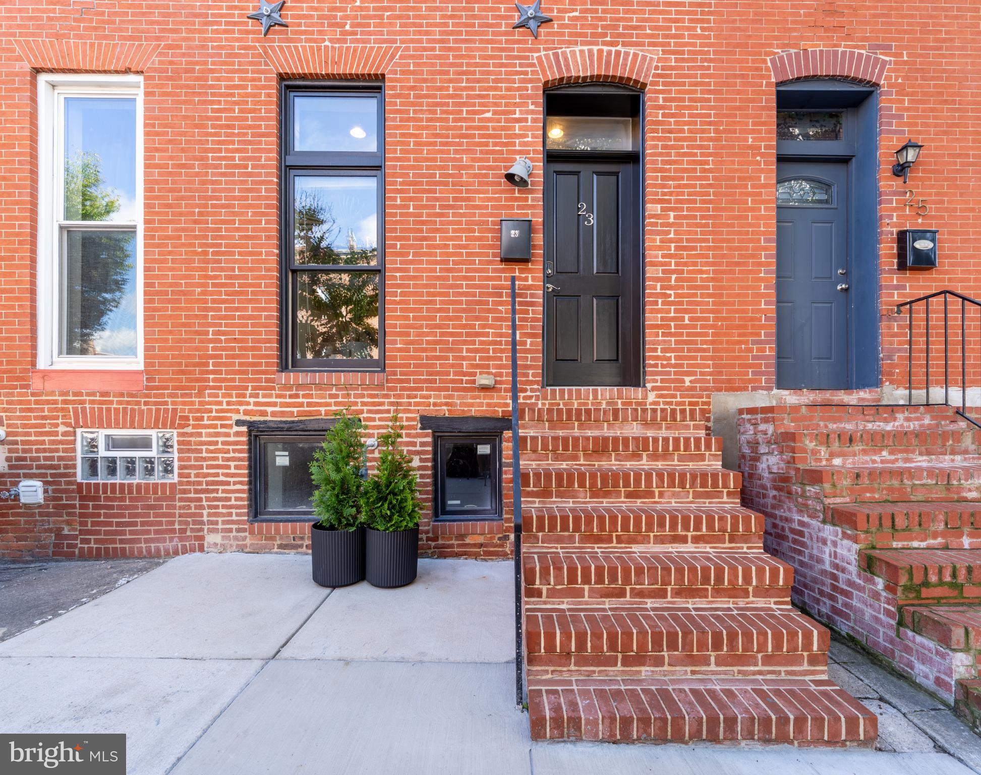 23 South Washington Street Baltimore, MD 21231 - Photo 1 of 57 a front view of a house with a garden