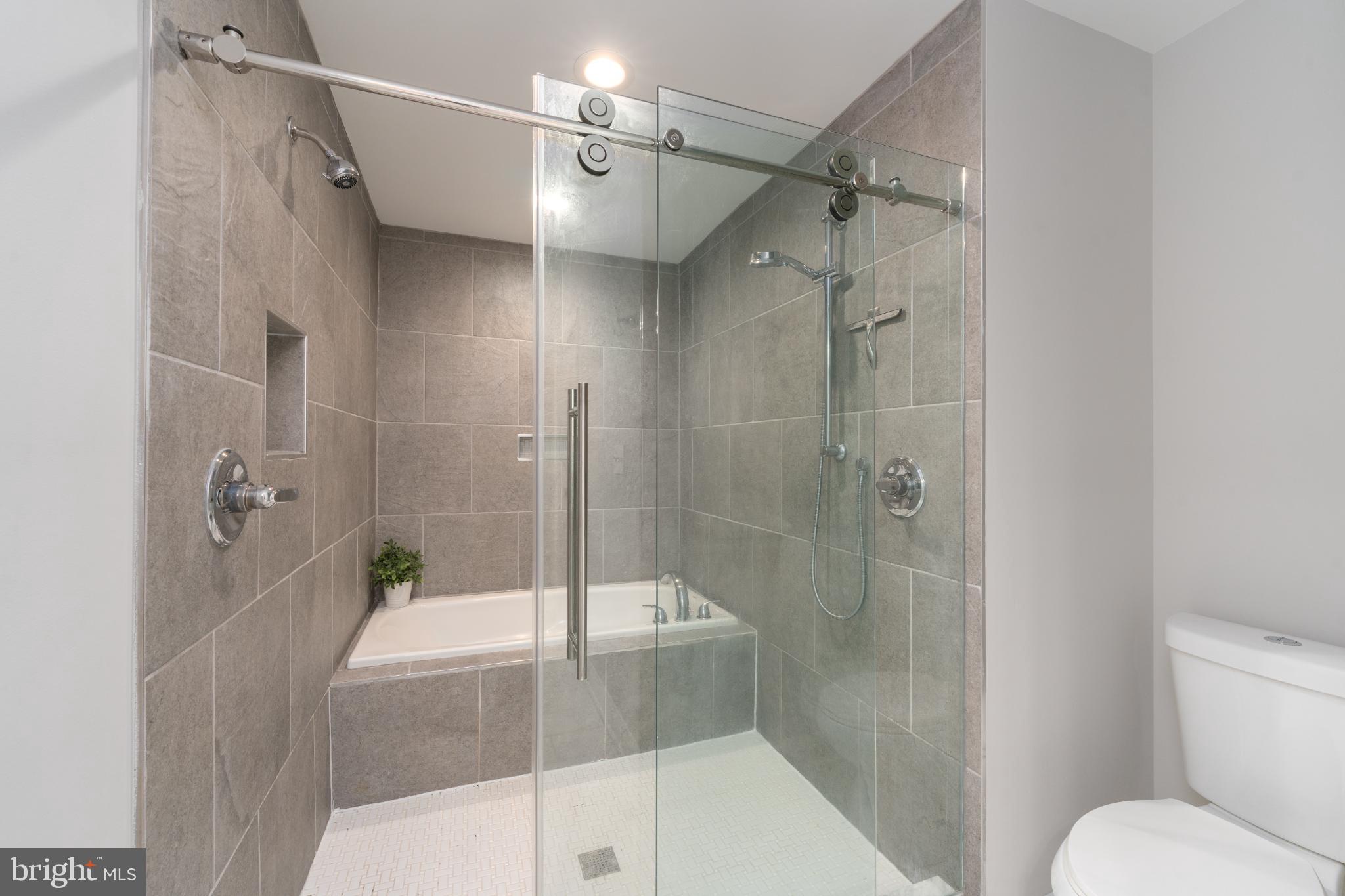 23 South Washington Street Baltimore, MD 21231 - Photo 27 of 57 a bathroom with a shower and a toilet