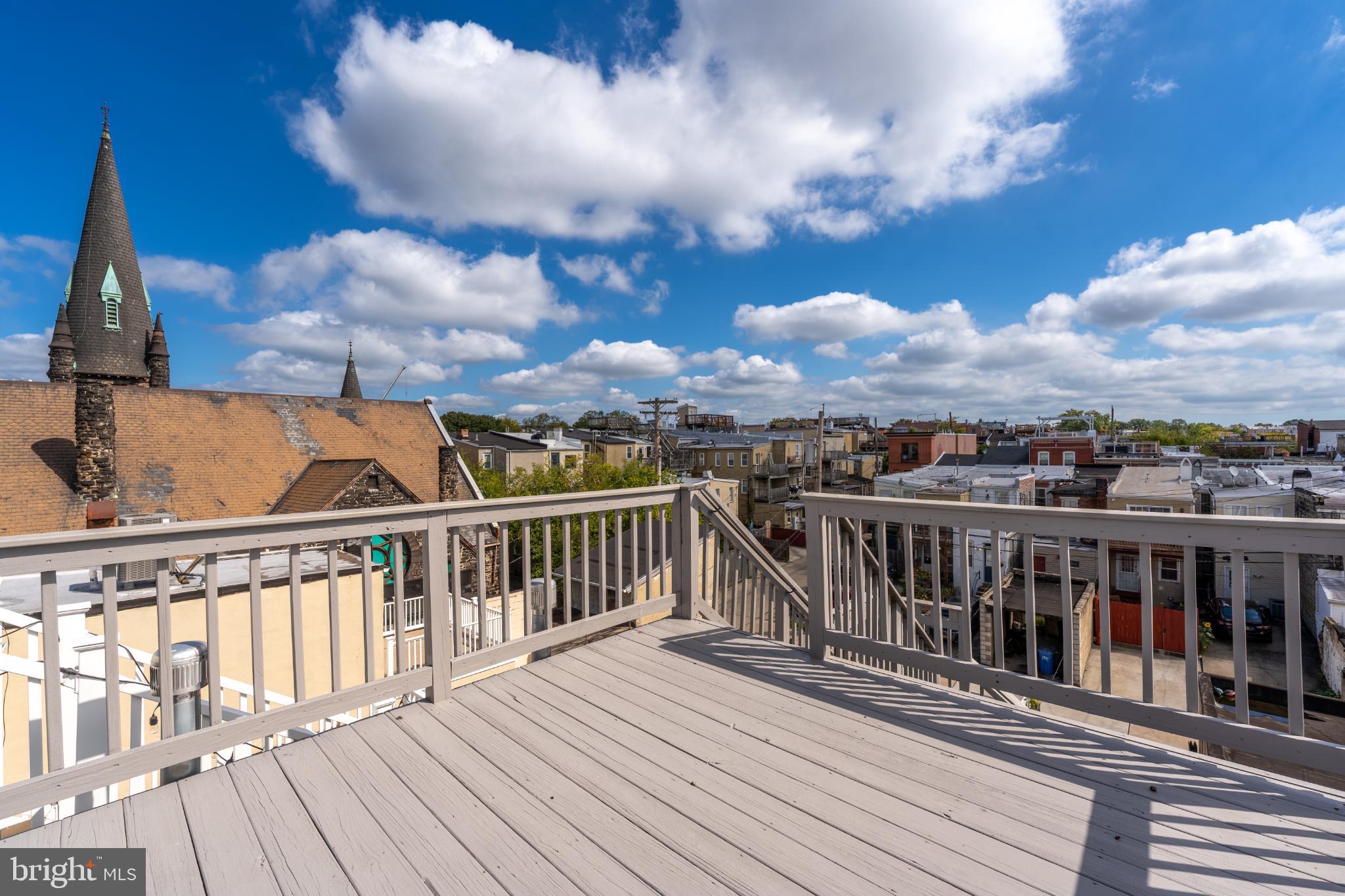 23 South Washington Street Baltimore, MD 21231 - Photo 36 of 57 a view of a balcony with wooden floor