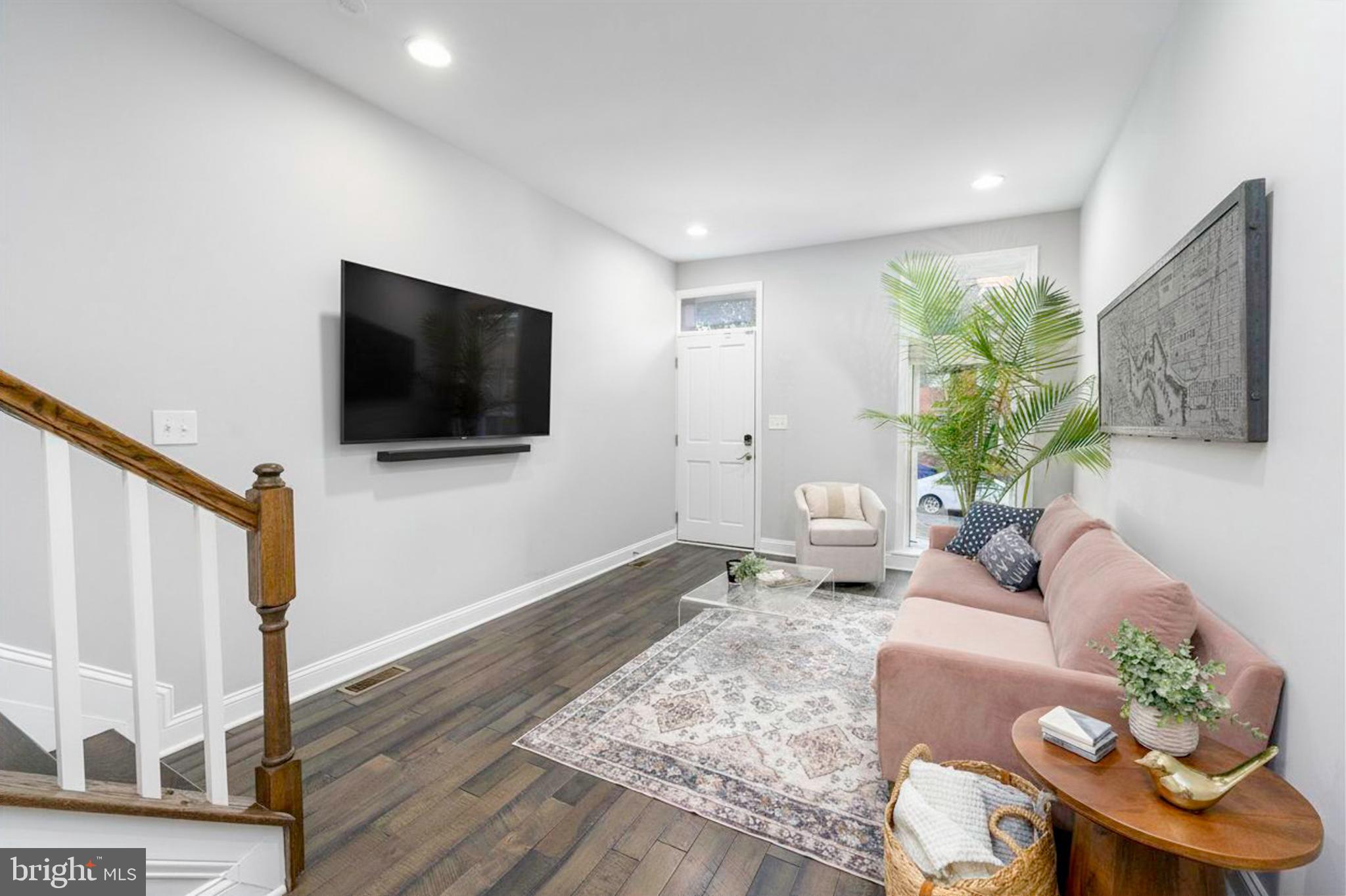23 South Washington Street Baltimore, MD 21231 - Photo 4 of 57 a living room with furniture and a flat screen tv