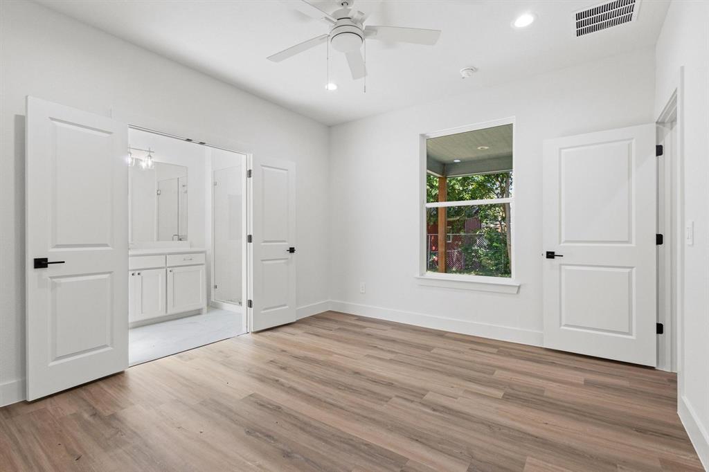 516 Florence Denison, TX 75020 - Photo 15 of 27 an empty room with wooden floor cabinet and windows