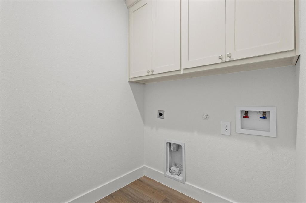 516 Florence Denison, TX 75020 - Photo 24 of 27 a view of storage and utility room with wooden floor