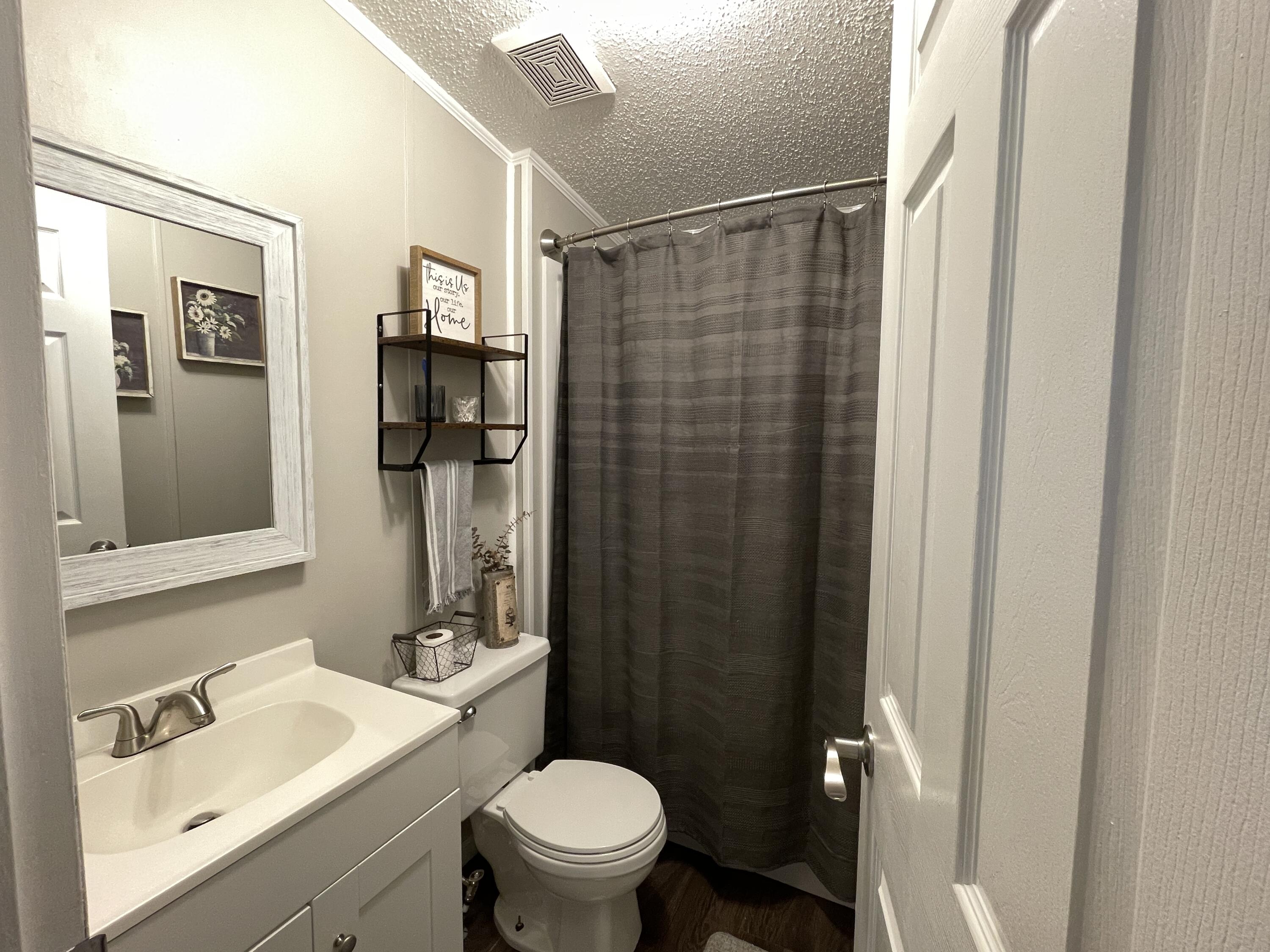 2166 Healing Springs Road Blackville, SC 29817 - Photo 25 of 43 a bathroom with a sink toilet and shower