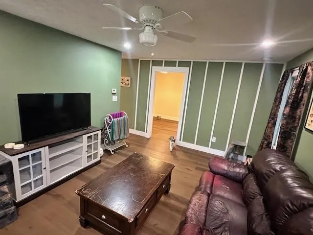 a living room with furniture and a flat screen tv