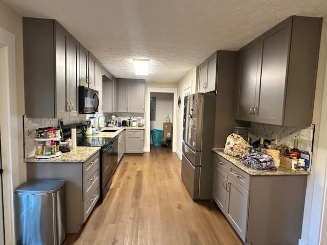 4073 Twin Springs Road Gainesville, GA 30507 - Photo 21 of 41 a kitchen with refrigerator and wooden cabinets