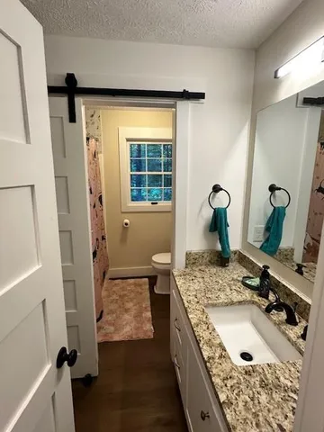 a bathroom with sink and mirror