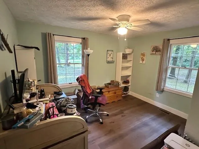 a room with gym equipment and a large window