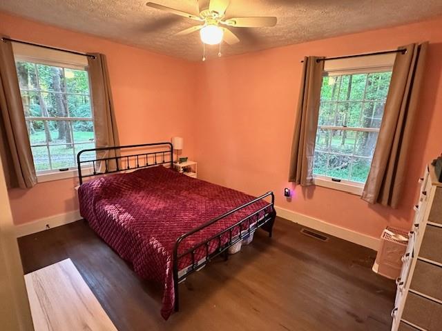 4073 Twin Springs Road Gainesville, GA 30507 - Photo 39 of 41 a bed sitting in a bedroom next to a window