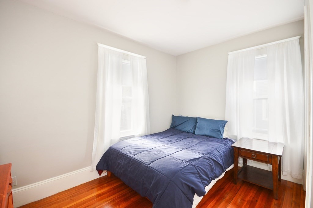 183 Cottage Park Road Winthrop, MA 02152 - Photo 13 of 35 a bedroom with a bed and a window