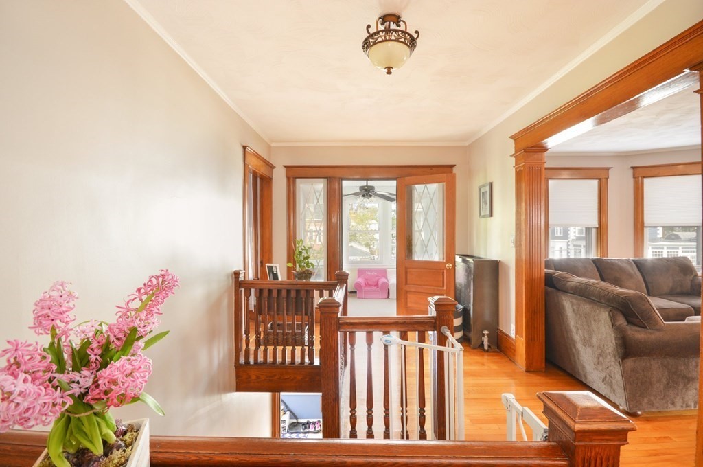 183 Cottage Park Road Winthrop, MA 02152 - Photo 15 of 35 a living room with furniture and a potted plant