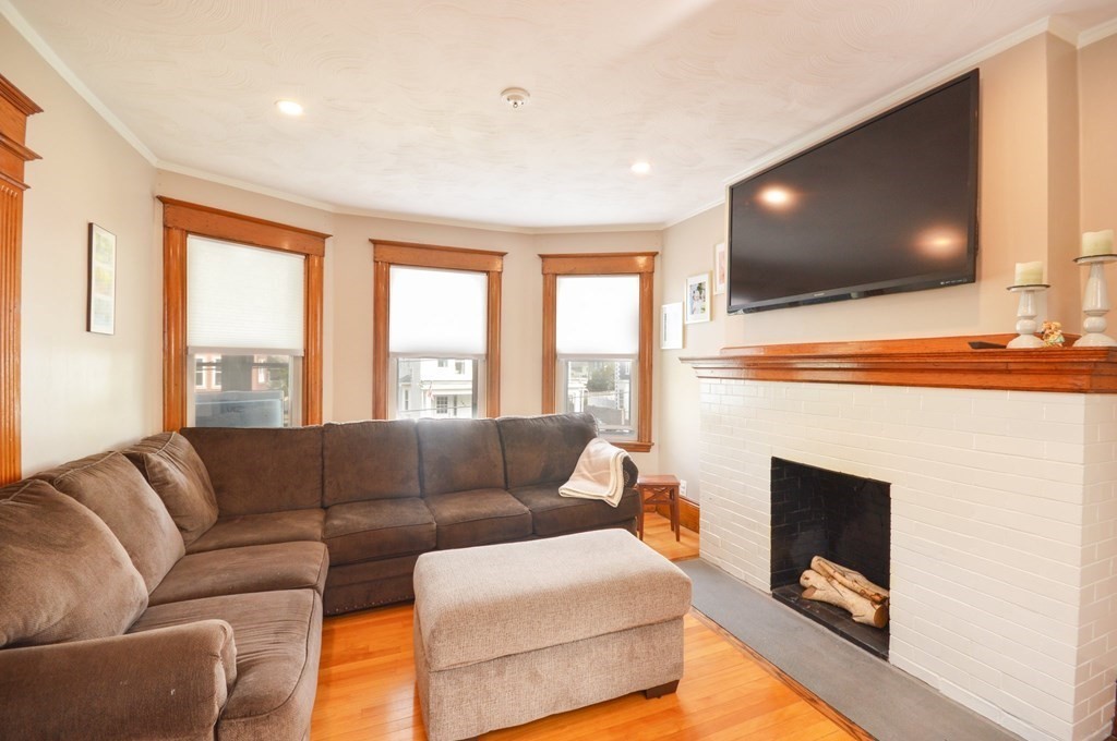 183 Cottage Park Road Winthrop, MA 02152 - Photo 16 of 35 a living room with furniture and a flat screen tv