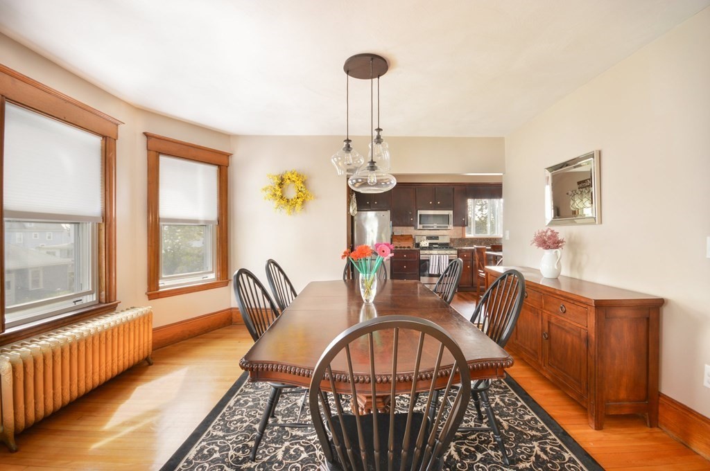 183 Cottage Park Road Winthrop, MA 02152 - Photo 17 of 35 a view of a dining room with furniture window and wooden floor