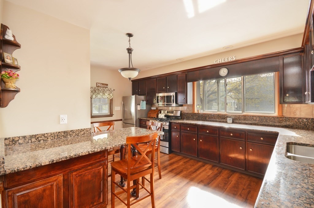 183 Cottage Park Road Winthrop, MA 02152 - Photo 20 of 35 a large kitchen with granite countertop a sink and dishwasher with a large window