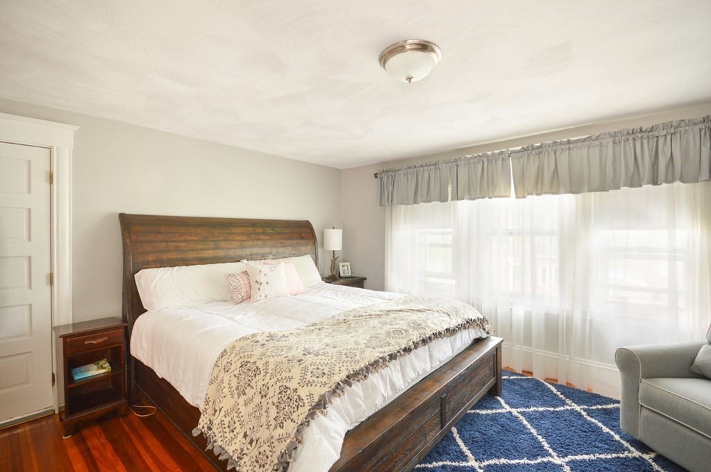 183 Cottage Park Road Winthrop, MA 02152 - Photo 27 of 35 a bedroom with a bed and a couch